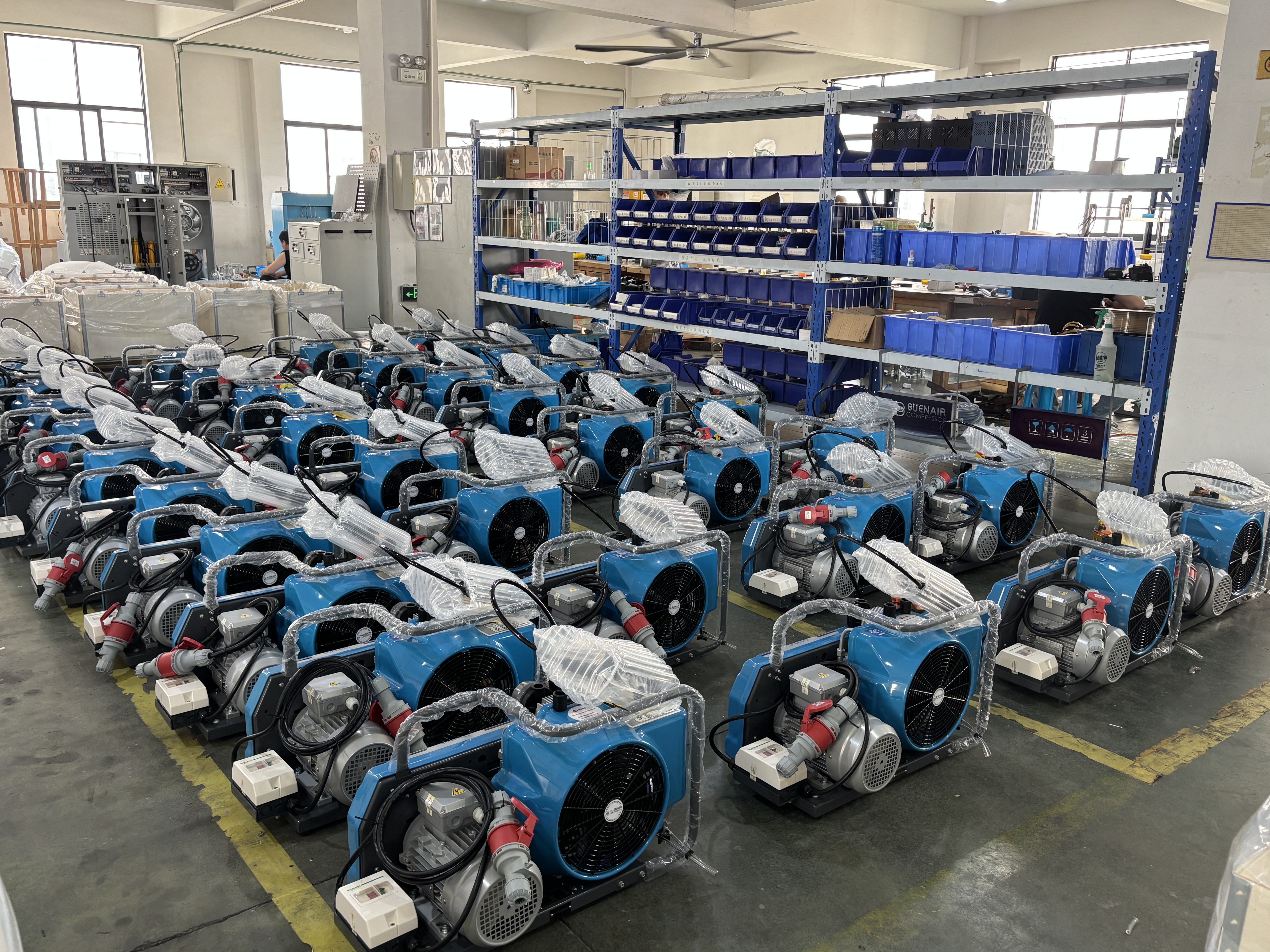 unpacked BUENAIR compressors prepared for inspection in workshop